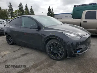 2021 Tesla Model Y Long Range z VIN 5YJYGAEE5MF143672, wystawiony jako Copart lot #55962875 z przebiegiem 74 644 mil mil oraz Szkoda całkowita • Salvage title. Historia ofert i sprzedaży dostępna na DreamBid. Obrazek 4.