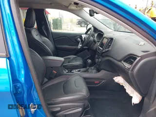 2022 Jeep Cherokee Trailhawk z VIN 1C4PJMBX4ND513488, wystawiony jako IAAI lot #42137114 z przebiegiem 12 306 mil mil oraz . Historia ofert i sprzedaży dostępna na DreamBid. Obrazek 5.