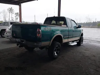 1997 Ford F-150 XL with VIN 1FTDX18W9VKC62901, listed as a IAAI auction lot 41495680 with 205,443 mi miles. Bid and sale history available at carsss.com. Image 4.