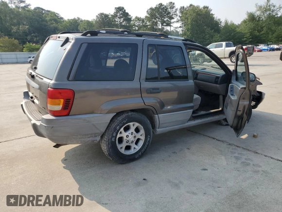 1999 Jeep Grand Cherokee Laredo with VIN 1J4G258S9XC731752, listed as a Copart auction lot 58601555 with 245,284 mi miles and Salvage title. Bid and sale history available at DreamBid. Image 3.