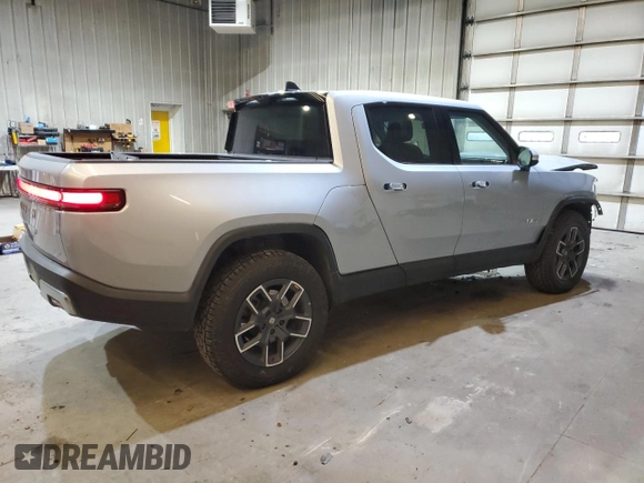 2024 Rivian R1T Adventure z VIN 7FCTGCAA0RN030370, wystawiony jako Copart lot #87251784 z przebiegiem 11 549 mil mil oraz Szkody całkowita. Historia ofert i sprzedaży dostępna na DreamBid. Obrazek 3.