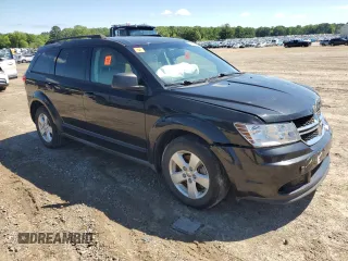 2013 Dodge Journey SE with VIN 3C4PDCAB5DT729415, listed as a Copart auction lot 55851915 with 128,782 mi miles and Salvage title. Bid and sale history available at DreamBid. Image 4.