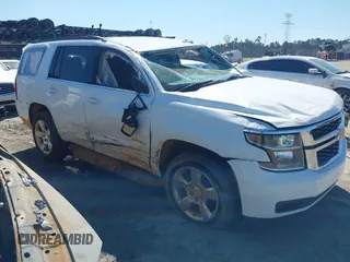 2020 Chevrolet Tahoe LS with VIN 1GNSCAKC4LR296015, listed as a IAAI auction lot 41827871 with 71,268 mi miles and . Bid and sale history available at DreamBid. Image 1.