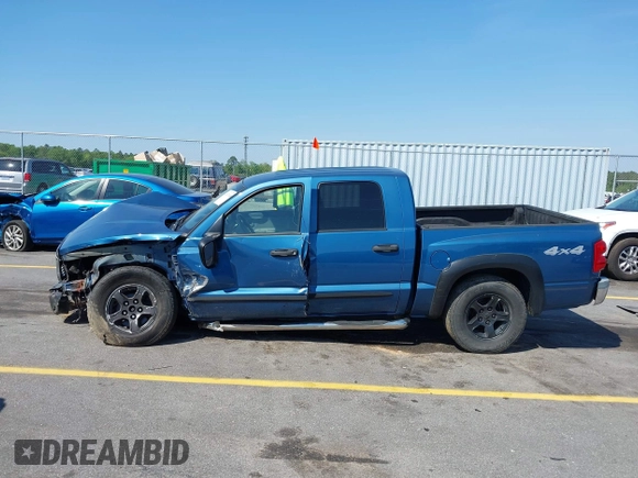 2005 Dodge Dakota SLT with VIN 1D7HW48N05S319621, listed as a IAAI auction lot 42037140 with 251,595 mi miles and . Bid and sale history available at DreamBid. Image 14.