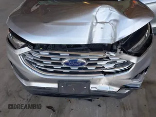 2020 Ford Edge SE z VIN 2FMPK3G97LBA60726, wystawiony jako IAAI lot #41996884 z przebiegiem 62 817 mil mil oraz . Historia ofert i sprzedaży dostępna na DreamBid. Obrazek 6.