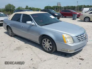 2006 Cadillac DTS 1SC z VIN 1G6KD57Y56U109483, wystawiony jako IAAI lot #42103757 z przebiegiem 106 746 mil mil oraz . Historia ofert i sprzedaży dostępna na DreamBid. Obrazek 1.