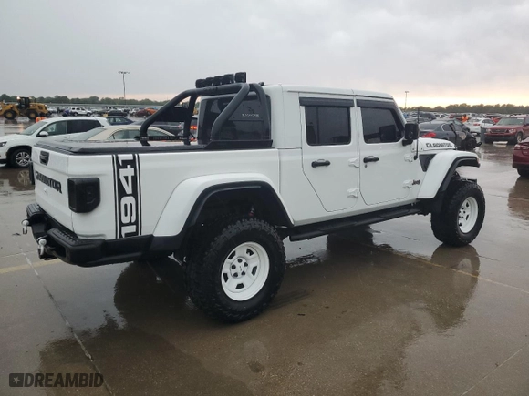 2022 Jeep Gladiator Rubicon with VIN 1C6JJTBG5NL152818, listed as a Copart auction lot 57170834 with 9,579 mi miles and Salvage Title. Bid and sale history available at carsss.com. Image 3.