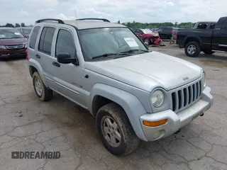 2002 Jeep Liberty Limited z VIN 1J4GL58K92W148750, wystawiony jako IAAI lot #42363212 z przebiegiem 221 362 mil mil oraz . Historia ofert i sprzedaży dostępna na DreamBid. Obrazek 1.