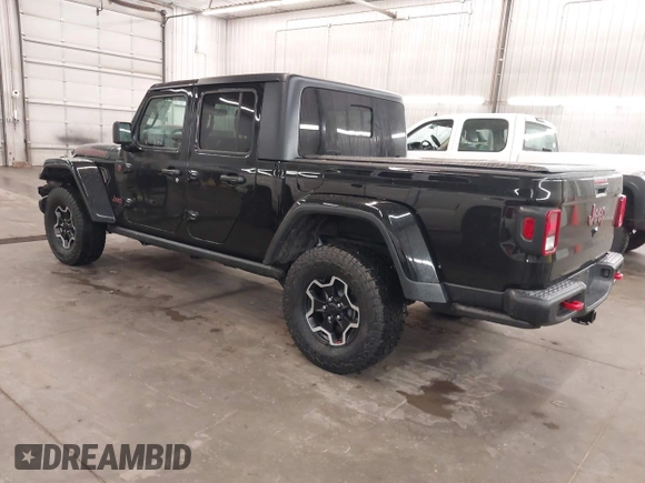2021 Jeep Gladiator Rubicon with VIN 1C6JJTBGXML529108, listed as a IAAI auction lot 42139924 with 32,204 mi miles and . Bid and sale history available at DreamBid. Image 3.