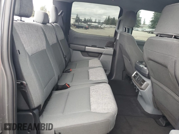 2023 Ford F-150 Lightning Pro with VIN 1FTVW1EL8PWG38419, listed as a Copart auction lot 47630535 with 11,940 mi miles and Salvage Title. Bid and sale history available at DreamBid. Image 10.