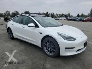 2021 Tesla Model 3 Standard Range Plus with VIN 5YJ3E1EA7MF087909, listed as a Copart auction lot 50942395 with 16,591 mi miles and Salvage Title. Bid and sale history available at carsss.com. Image 4.