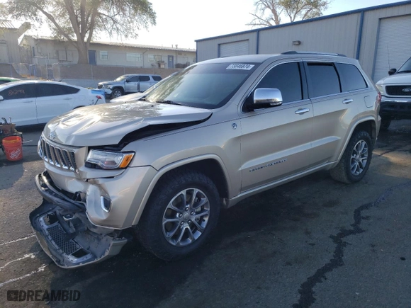 2014 Jeep Grand Cherokee Overland with VIN 1C4RJFCM2EC556953, listed as a Copart auction lot 73046974 with 106,889 mi miles and Salvage Title. Bid and sale history available at carsss.com. Image 1.