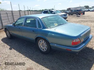 1998 Jaguar XJ with VIN SAJHX1241WC819418, listed as a IAAI auction lot 42456539 with 126,457 mi miles and . Bid and sale history available at DreamBid. Image 3.