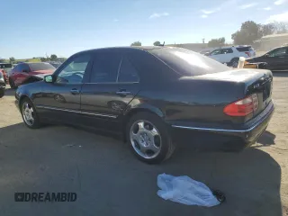 2001 Mercedes-Benz E-Class with VIN WDBJF70JX1B327997, listed as a Copart auction lot 87650175 with 268,045 mi miles and Salvage Title. Bid and sale history available at carsss.com. Image 2.