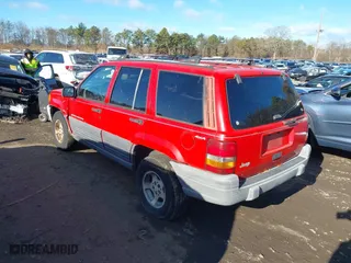1997 Jeep Grand Cherokee Laredo with VIN 1J4GZ58S0VC550242, listed as a IAAI auction lot 41032114 with 185,307 mi miles. Bid and sale history available at carsss.com. Image 3.