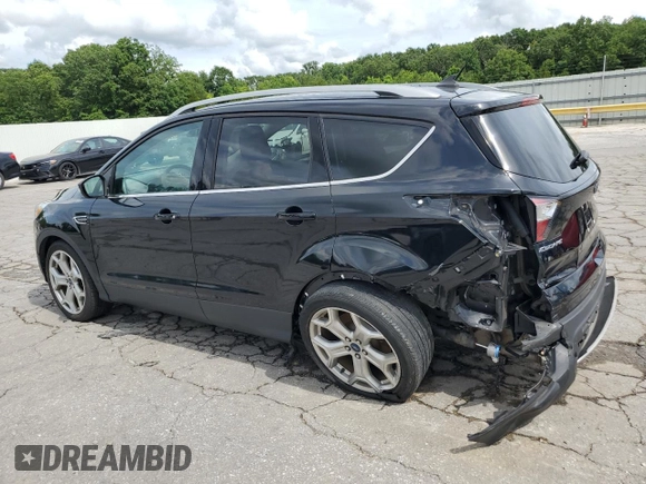 2018 Ford Escape Titanium with VIN 1FMCU0J92JUC84901, listed as a Copart auction lot 60428635 with 69,210 mi miles and Salvage title. Bid and sale history available at DreamBid. Image 2.