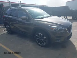 2016 Mazda CX-5 Grand Touring with VIN JM3KE2DY1G0649720, listed as a IAAI auction lot 41674273 with 184,483 mi miles. Bid and sale history available at carsss.com. Image 1.