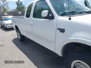 2001 Ford F-150 XL z VIN 1FTRX18W31KF80478, wystawiony jako IAAI lot #42219605 z przebiegiem 127 284 mil mil oraz . Historia ofert i sprzedaży dostępna na DreamBid. Obrazek 6.