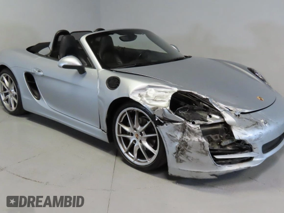 2014 Porsche Boxster with VIN WP0CA2A83ES120705, listed as a Copart auction lot 58605535 with 65,603 mi miles and Salvage title. Bid and sale history available at DreamBid. Image 1.
