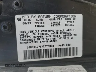 1999 Saturn SC with VIN 1G8ZR1275XZ375833, listed as a Copart auction lot 87960885 with 97,697 mi miles and Salvage Title. Bid and sale history available at carsss.com. Image 12.
