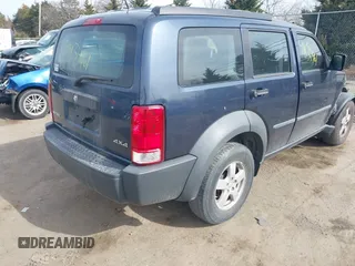 2008 Dodge Nitro SXT with VIN 1D8GU28K28W189765, listed as a IAAI auction lot 41834961 with 214,837 mi miles. Bid and sale history available at carsss.com. Image 4.
