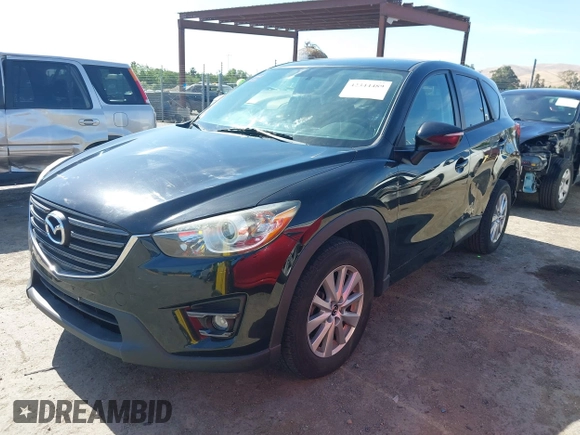 2016 Mazda CX-5 Touring z VIN JM3KE4CY2G0656270, wystawiony jako IAAI lot #42344489 z przebiegiem 60 449 mil mil oraz . Historia ofert i sprzedaży dostępna na DreamBid. Obrazek 19.
