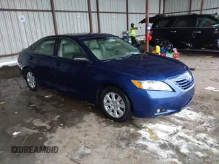 2007 Toyota Camry LE z VIN JTNBK46K173015971, wystawiony jako IAAI lot #42194579 z przebiegiem 116 226 mil mil oraz . Historia ofert i sprzedaży dostępna na DreamBid. Obrazek 1.