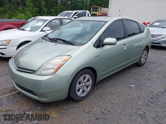 2007 Toyota Prius z VIN JTDKB20U077602951, wystawiony jako IAAI lot #42384098 z przebiegiem 169 136 mil mil oraz . Historia ofert i sprzedaży dostępna na DreamBid. Obrazek 2.