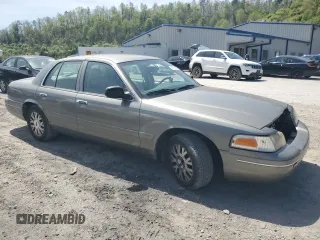 2004 Ford Crown Victoria LX z VIN 2FAFP74W14X130606, wystawiony jako Copart lot #54120085 z przebiegiem 221 700 mil mil oraz Szkody całkowita. Historia ofert i sprzedaży dostępna na DreamBid. Obrazek 4.