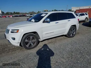2014 Jeep Grand Cherokee Overland with VIN 1C4RJFCG9EC587322, listed as a IAAI auction lot 41632299 with 161,779 mi miles. Bid and sale history available at carsss.com. Image 2.