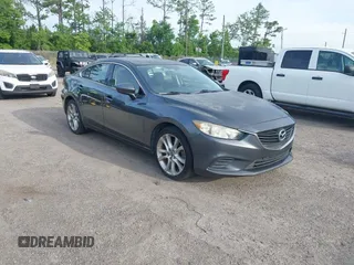 2014 Mazda 6 i Touring with VIN JM1GJ1V68E1156187, listed as a IAAI auction lot 42374390 with 138,214 mi miles and . Bid and sale history available at DreamBid. Image 1.