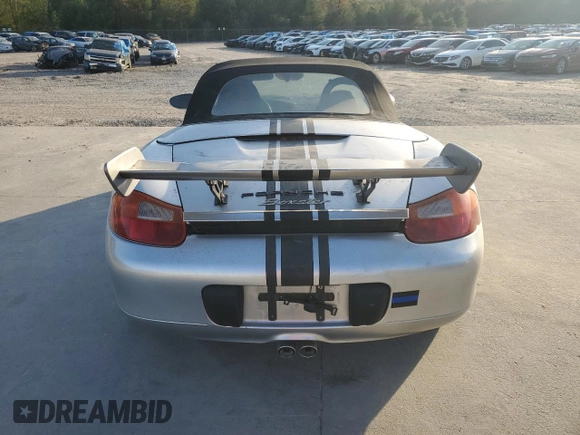 1998 Porsche Boxster с VIN WP0CA2987WS620369, выставлен на аукционе Copart как лот 81003964 с пробегом Не указан миль и Списание • Salvage title. История ставок и продаж доступна на DreamBid. Изображение 6.
