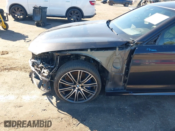 2018 BMW 5 Series M550i xDrive with VIN WBAJB9C57JG463933, listed as a IAAI auction lot 41295711 with 99,173 mi miles and . Bid and sale history available at carsss.com. Image 6.