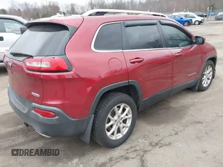 2015 Jeep Cherokee Latitude with VIN 1C4PJMCS6FW594812, listed as a IAAI auction lot 41709068 with 125,232 mi miles. Bid and sale history available at carsss.com. Image 4.