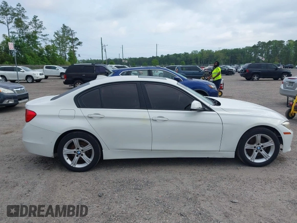 2015 BMW 3 Series 328i with VIN WBA3A5C50FF608327, listed as a IAAI auction lot 42136156 with 213,945 mi miles. Bid and sale history available at carsss.com. Image 13.