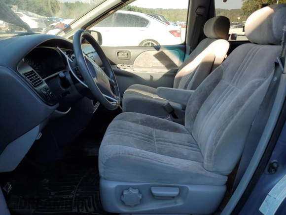 1999 Toyota Sienna LE with VIN 4T3ZF13C8XU108650, listed as a Copart auction lot 74476004 with 215,060 mi miles and Salvage Title. Bid and sale history available at carsss.com. Image 7.