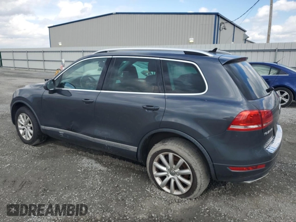 2012 Volkswagen Touareg Sport с VIN WVGEK9BP7CD006059, выставлен на аукционе Copart как лот 49411245 с пробегом 202 323 миль миль и Чистый • Clean title. История ставок и продаж доступна на DreamBid. Изображение 2.