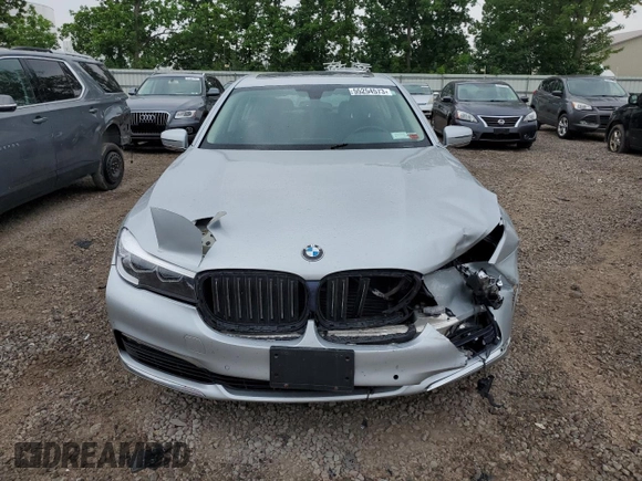 2018 BMW 7 Series 740i xDrive with VIN WBA7E4C56JGV23835, listed as a Copart auction lot 55254573 with 103,713 mi miles. Bid and sale history available at carsss.com. Image 5.