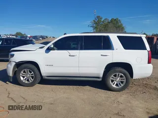 2015 Chevrolet Tahoe LT with VIN 1GNSCBKC0FR104096, listed as a IAAI auction lot 41679298 with 231,005 mi miles and . Bid and sale history available at DreamBid. Image 14.