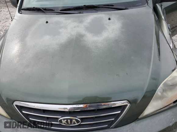 2007 Kia Sorento LX z VIN KNDJC736275723933, wystawiony jako Copart lot #50140505 z przebiegiem 260 464 mil mil oraz Szkoda całkowita • Salvage title. Historia ofert i sprzedaży dostępna na DreamBid. Obrazek 13.