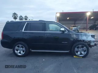 2015 Chevrolet Tahoe LTZ z VIN 1GNSKCKC5FR213209, wystawiony jako IAAI lot #41023368 z przebiegiem Nie podano mil oraz . Historia ofert i sprzedaży dostępna na DreamBid. Obrazek 12.