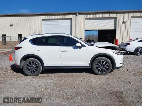 2018 Mazda CX-5 Grand Touring with VIN JM3KFADM0J0377026, listed as a IAAI auction lot 41649686 with 100,901 mi miles and . Bid and sale history available at DreamBid. Image 13.