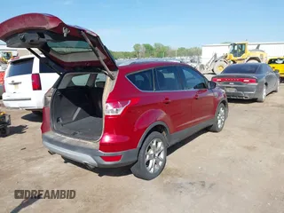 2014 Ford Escape Titanium with VIN 1FMCU0J91EUE12034, listed as a IAAI auction lot 42027493 with 160,417 mi miles and . Bid and sale history available at DreamBid. Image 4.