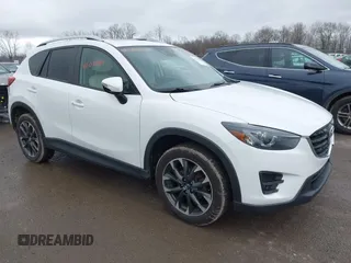 2016 Mazda CX-5 Grand Touring z VIN JM3KE4DY0G0705884, wystawiony jako IAAI lot #42016910 z przebiegiem 73 324 mil mil oraz . Historia ofert i sprzedaży dostępna na DreamBid. Obrazek 1.