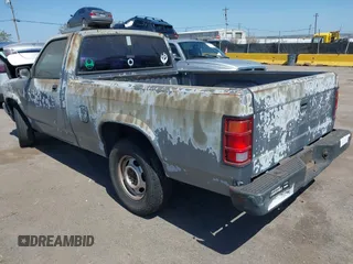 1992 Dodge Dakota S with VIN 1B7FL26X5NS691362, listed as a IAAI auction lot 42001454 with 161,181 mi miles and . Bid and sale history available at carsss.com. Image 3.