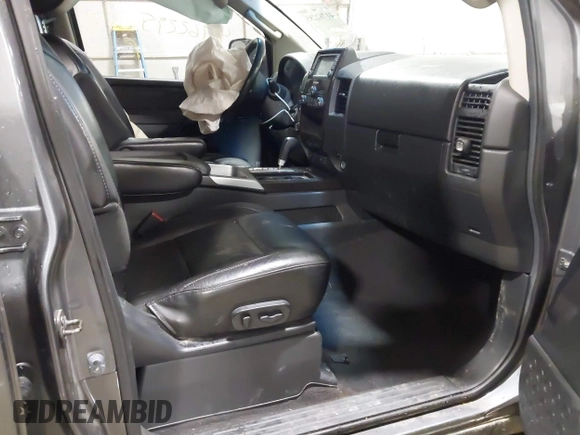 2014 Nissan Titan S with VIN 1N6AA0EC6EN513801, listed as a IAAI auction lot 41762295 with 128,412 mi miles and . Bid and sale history available at DreamBid. Image 5.