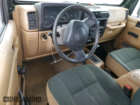 1998 Jeep Wrangler Sahara с VIN 1J4FY49S0WP727745, выставлен на аукционе Copart как лот 60546955 с пробегом 139 476 миль миль и Чистый • Clean title. История ставок и продаж доступна на DreamBid. Изображение 8.