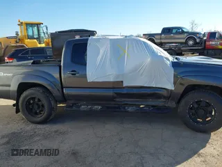 2014 Toyota Tacoma with VIN 3TMLU4EN0EM148389, listed as a IAAI auction lot 41490721 with 119,731 mi miles. Bid and sale history available at carsss.com. Image 13.