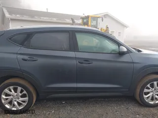 2019 Hyundai Tucson Value with VIN KM8J33A44KU995257, listed as a IAAI auction lot 41672206 with 63,090 mi miles. Bid and sale history available at carsss.com. Image 14.