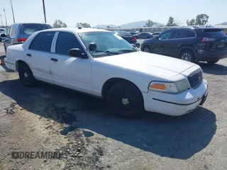 1999 Ford Crown Victoria Police z VIN 2FAFP71W1XX200937, wystawiony jako IAAI lot #41977836 z przebiegiem 186 379 mil mil oraz . Historia ofert i sprzedaży dostępna na DreamBid. Obrazek 1.